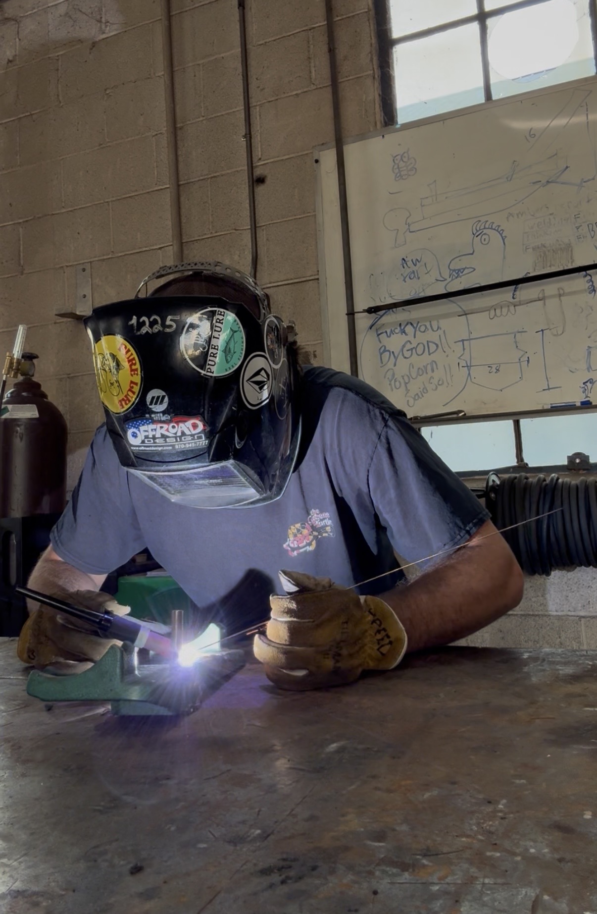 TIG welding at the fabrication bench in the workshop