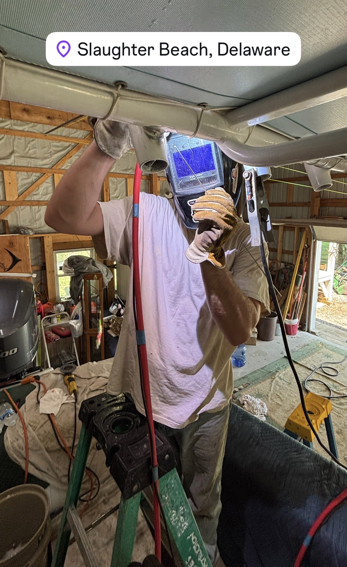 Reed welding overhead on a tall workpiece
